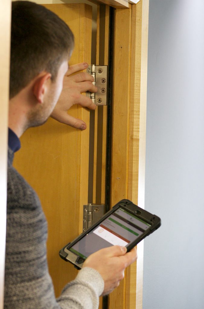 Fire Door Inspection Adaston worker with Tablet