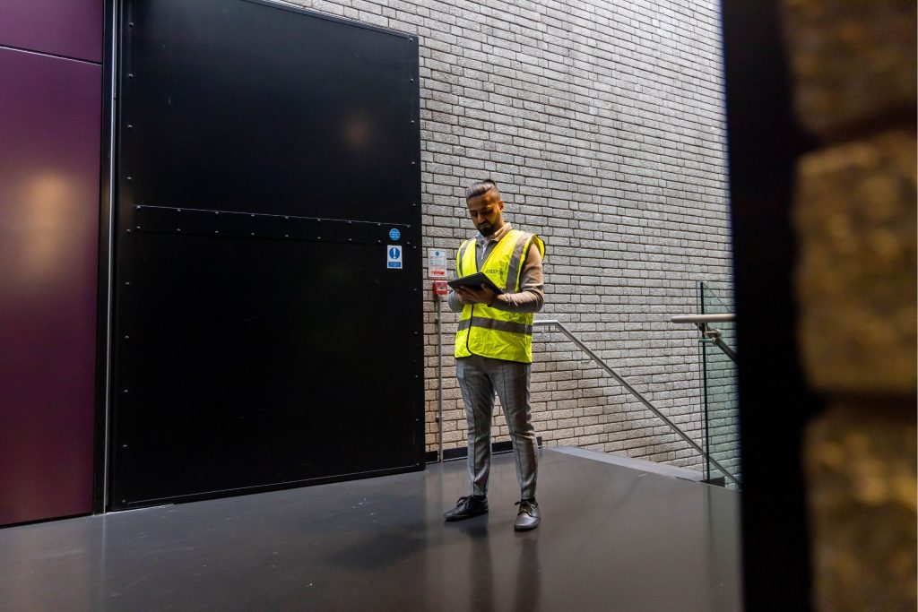 A fire safety worker completing a passive fire protection survey